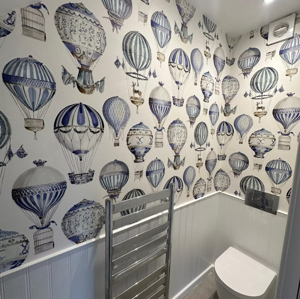 Small bathroom renovation with hot air balloon wallpaper by builders Winchester.