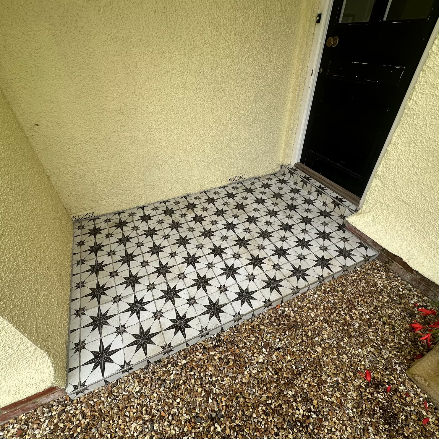 Decorative floor tiling and entryway renovation by builders Winchester.